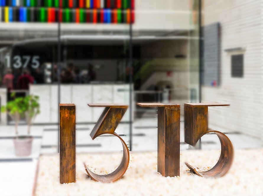 Custom architectural signage integrated into a building facade